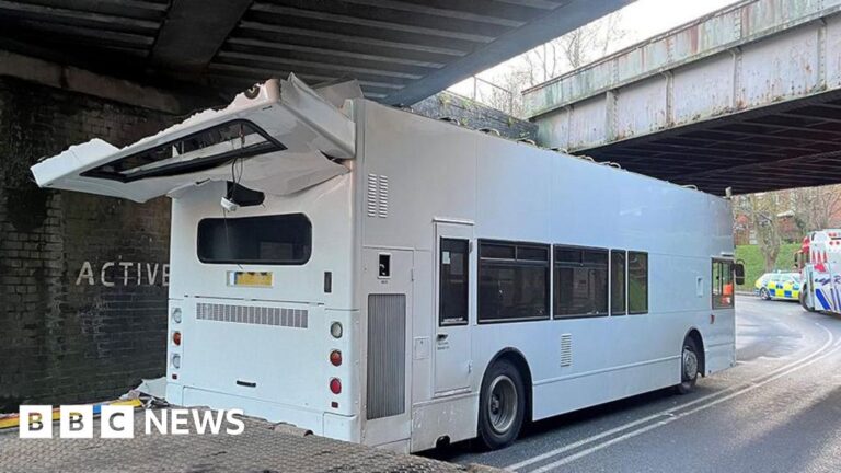 Children hurt as roof of school bus ripped off by Coppull bridge